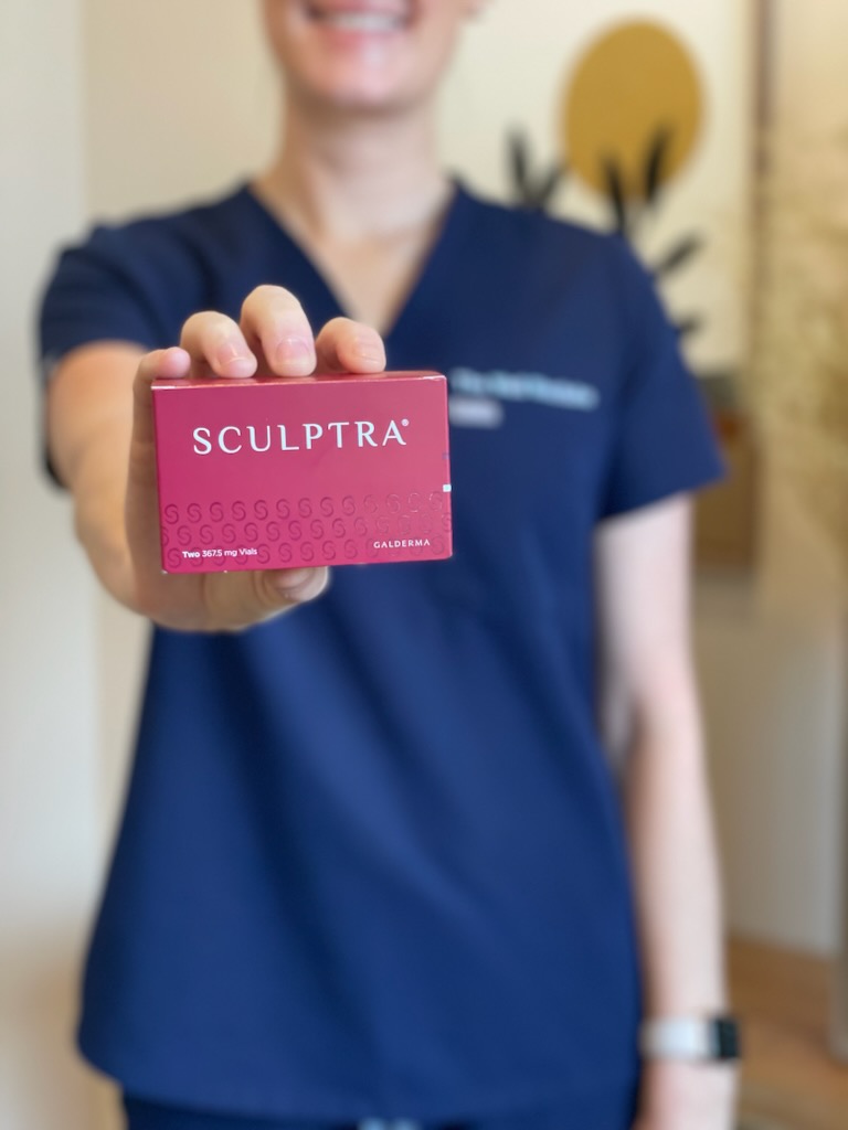 An injector nurse is holding up a box of Sculptra in Westlake, OH.