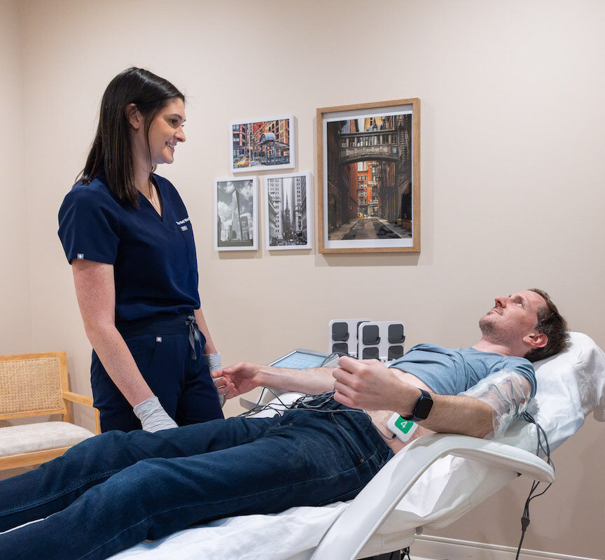 A man is lying down with electrodes attached to his chest for TruFlex near Cleveland.
