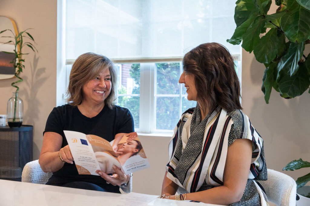 A patient is having a consultation with a provider at The Well Westlake to discuss her options at their weight loss clinic in Westlake, OH.