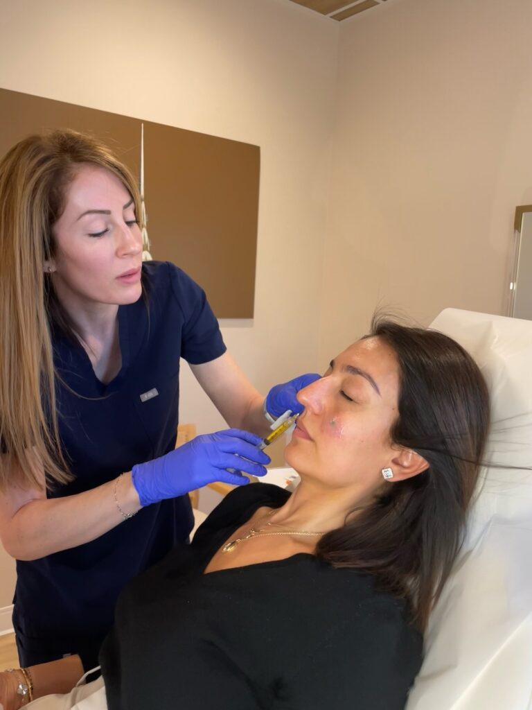 A The Well Westlake provider injects PRP as a form of dermal filler in Westlake, OH under a patient's eye.