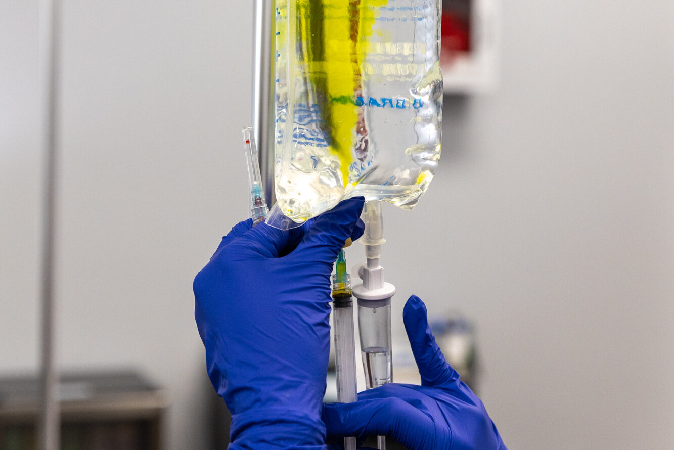 One of our holistic doctors in Cleveland prepares a custom IV drip to help advance a patient's wellness goals.