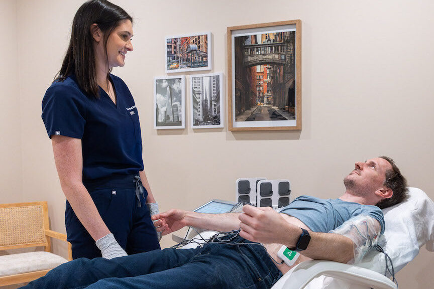 After consulting with our holistic doctors in Cleveland, a patient undergoes TruFlex muscle sculpting treatments.