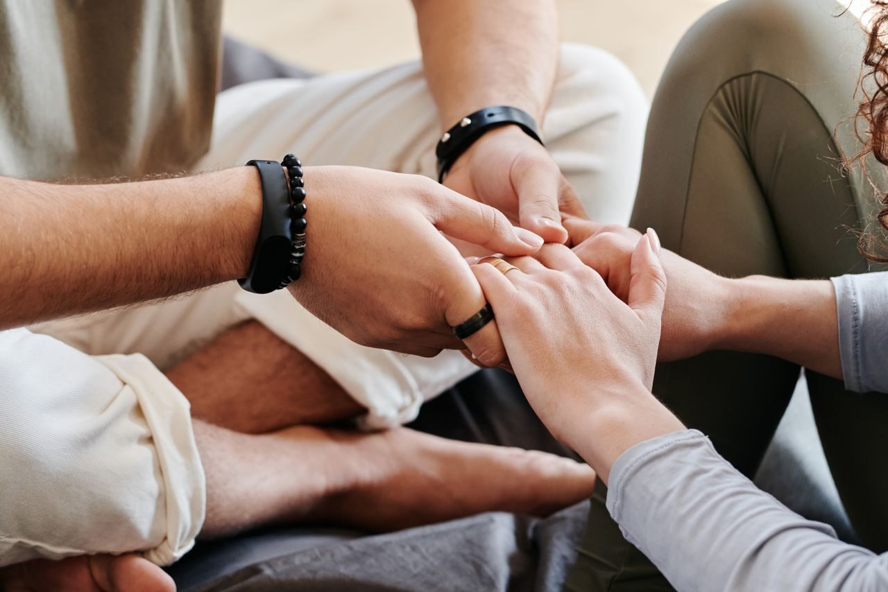 A couple holds hands, enjoying renewed intimacy after seeing our HRT doctors near Avon Lake.